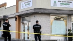 Police outside the Centre Culturel Musulman in Chateauguay, Que., Friday Sept. 20, 2024, where a man entered the mosque with a knife during afternoon prayers leading to the injury of three people. THE CANADIAN PRESS/Graham Hughes