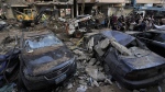 Damaged cars at the site of Friday's Israeli strike in Beirut's southern suburbs, Saturday, Sept. 21, 2024. (Bilal Hussein/AP Photo)