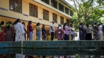 People wait in a queue to cast their votes at a polling center during the presidential election on the outskirts of Colombo, Sri Lanka Saturday, Sept. 21, 2024. (Rajesh Kumar Singh/AP Photo)