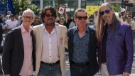 Johnny Fay, Paul Langlois, Gord Sinclair and Rob Baker (left to right) of The Tragically Hip stand for a photo at the Toronto International Film Festival, in Toronto, Thursday, Sept. 5, 2024. THE CANADIAN PRESS/Paige Taylor White