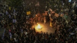 People protest against Israeli Prime Minister Benjamin Netanyahu's government and call for the release of hostages held in the Gaza Strip by the Hamas militant group, in Tel Aviv, Israel, Saturday, Sept. 21, 2024. (AP Photo/Mahmoud Illean)