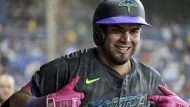 Tampa Bay Rays' Jonathan Aranda celebrates in the dugout after his two-run home run off Toronto Blue Jays starter Yariel Rodríguez during the third inning of a baseball game Saturday, Sept. 21, 2024, in St. Petersburg, Fla. (AP Photo/Steve Nesius)