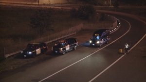 Police are pictured at Highway 401 near Stevenson Road after a pedestrian was fatally struck Saturday September 21, 2024. 