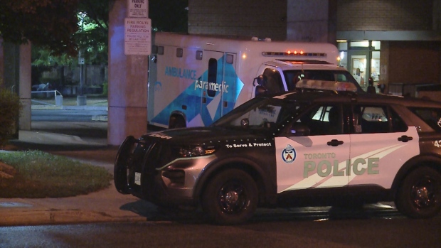 Toronto police are pictured next to an ambulance after a shooting victim was transported to hospital from the area of Kingston and Markham roads Saturday September 21, 2024. 