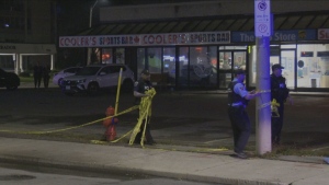 Police are pictured outside a sports bar in Hamilton following a shooting Sunday September 22, 2024. 