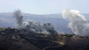 Smoke rises from Israeli airstrikes on Taybeh village, seen from the southern town of Marjayoun, Lebanon, Monday, Sept. 23, 2024. (AP Photo/Hussein Malla)