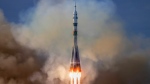 In this photo released by Roscosmos space corporation, the Soyuz 2.1a rocket with Soyuz MS-25 spacecraft to the International Space Station, ISS, lifts off from the Russian-leased Baikonur launch facility in Kazakhstan, Saturday, March 23, 2024. (Roscosmos space corporation via AP)