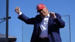 Republican presidential nominee Donald Trump dances after speaking at a campaign rally at Wilmington International Airport, Saturday, Sept. 21, 2024, in Wilmington, N.C. (AP Photo/Alex Brandon)