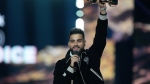 Karan Aujla accepts the fan's choice award at the Juno Awards, in Halifax, Sunday, March 24, 2024. (THE CANADIAN PRESS/Darren Calabrese)