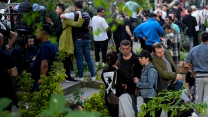 People gather as firefighters and medical teams work after a fire broke out in a nightclub, in Istanbul, Turkiye, April 2, 2024. (AP Photo/Khalil Hamra)
