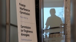 A man enters the hearing room as the Public Inquiry into Foreign Election Interference resumes in Ottawa, Monday, Sept. 16, 2024. THE CANADIAN PRESS/Adrian Wyld