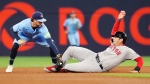 Toronto Blue Jays shortstop Ernie Clement (28) tags out Boston Red Sox's Triston Casas (36) at second base during fourth inning American League MLB baseball action in Toronto on Tuesday, September 24, 2024. THE CANADIAN PRESS/Chris Young