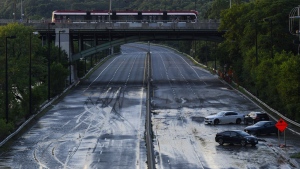 The Insurance Bureau of Canada estimates over seven billion dollars in insured losses following four catastrophic weather events this summer. Cars remain stranded on the Don Valley Parkway as water recedes following heavy rain that caused flooding in Toronto on Tuesday, July 16, 2024. THE CANADIAN PRESS/Christopher Katsarov