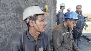 In this photo released on Tuesday, Sept. 24, 2024, by Iranian Interior Ministry, miners sit at the site of a coal mine where methane leak sparked an explosion on Saturday, in Tabas, some 335 miles (540 kilometres) southeast of the capital Tehran, Iran. (Iranian Interior Ministry via AP)