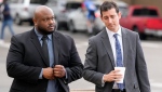 Former Memphis police officer Desmond Mills, left, arrives at the federal courthouse with his attorney Blake Ballin, right, to testify against his former colleagues during the trial in the Tyre Nichols case Wednesday, Sept. 25, 2024, in Memphis, Tenn. (AP Photo/George Walker IV)