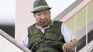 Iwao Hakamada, 88-year-old former boxer who has been on death row for nearly six decades after his murder conviction that his lawyers said was based on forced confession and fabricated evidence, goes for a walk in Hamamatsu, Shizuoka prefecture, central Japan Thrusday, Sept. 26, 2024. (Kyodo News via AP)