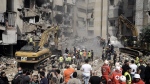 Emergency workers use excavators to clear the rubble at the site of Friday's Israeli strike in Beirut's southern suburbs, Saturday, Sept. 21, 2024. (AP Photo/Bilal Hussein, File)