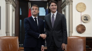 Prime Minister Justin Trudeau, right, and French President Emmanuel Macron shake hands before meeting on Parliament Hill, Thursday, Sept. 26, 2024 in Ottawa. THE CANADIAN PRESS/Adrian Wyld