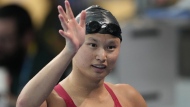 Canada's Maggie Mac Neil, of London, Ont. waves after winning gold medal in the 100m butterfly final at the Pan American Games in Santiago, Chile on Sunday Oct. 22, 2023. Olympic champion Mac Neil has retired from swimming. THE CANADIAN PRESS/Frank Gunn