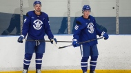 Toronto Maple Leafs forward Auston Matthews (34) and teammate Mitch Marner (16) look up ice during training camp in Toronto on Thursday, September 19, 2024. THE CANADIAN PRESS/Nathan Denette