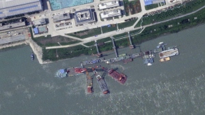 This satellite image from Planet Labs PBC shows what appears to be a sunken Chinese submarine at a shipyard near Wuhan, China, June 15, 2024. (Planet Labs PBC via AP)