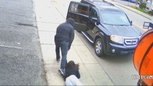 Dramatic video shows woman dragged during robbery