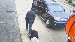 Dramatic video shows woman dragged during robbery