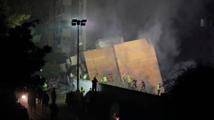 Rescuers arrive at the site of an Israeli airstrike in Beirut's southern suburbs, Sept. 27, 2024, in Lebanon. (Hassan Ammar / AP Photo)