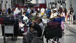 Canada booking seats on Passengers whose flights were cancelled, wait at the departure terminal of Rafik Hariri International Airport, in Beirut, Lebanon, on Aug. 5. Global Affairs Canada is booking blocks of seats on some commercial flights leaving Lebanon to help Canadians trying to flee as Israeli strikes escalated Friday. THE CANADIAN PRESS/AP-Hussein Mallaflights out of Lebanon