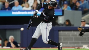 Miami Marlins' Xavier Edwards (63) hits a two-run triple against the Toronto Blue Jays during second inning interleague MLB baseball action in Toronto, Friday, Sept. 27, 2024. THE CANADIAN PRESS/Chris Young