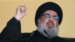 In this Oct. 24, 2015 file photo, Hezbollah leader Sheik Hassan Nasrallah addresses a crowd during the holy day of Ashoura, in a southern suburb of Beirut, Lebanon. (AP Photo/Hassan Ammar, File)