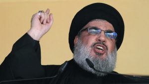 In this Oct. 24, 2015 file photo, Hezbollah leader Sheik Hassan Nasrallah addresses a crowd during the holy day of Ashoura, in a southern suburb of Beirut, Lebanon. (AP Photo/Hassan Ammar, File)