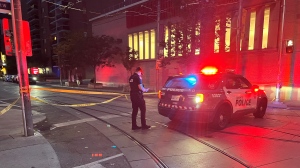 Police investigate after shots were fired near McCaul and Queen streets Saturday September 28, 2024. (Simon Sheehan /CP24)