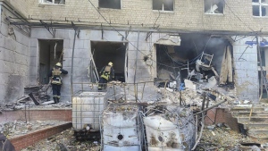 In this photo provided by the Ukrainian Emergency Service, emergency services workers look to move rubble and find injured after Russian attacks on a medical centre in the northeastern Ukrainian city of Sumy Saturday, Sept. 28, 2024. (Ukrainian Emergency Service via AP)