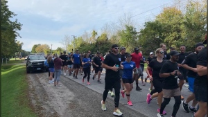 Officers completing the first leg on the final day of the National Police Officers' Memorial Run just east of Brockville, Ont. Sept. 28, 2024. (Jack Richardson/CTV News Ottawa). 