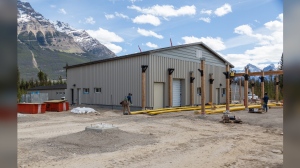 The handling barn at the caribou captive breeding centre, as shown in this handout image, in Jasper National Park remained relatively undamaged by the wildfire that swept through the park this summer. The barn, shown here before the fire, will handle up to 40 pregnant cows, providing a safe place to deliver their calves and help replenish the park's vanishing herds. THE CANADIAN PRESS/HO-Parks Canada 