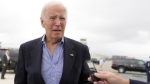 President Joe Biden speaks to reporters before boarding Air Force One at Dover Air Force Base, in Dover, Del., Sunday, Sept. 29, 2024, to return to Washington. (AP Photo/Manuel Balce Ceneta)