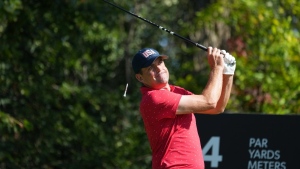 United States team member Keegan Bradley hits his shot from the 4th tee during his fifth round singles match at the Presidents Cup golf tournament at Royal Montreal Golf Club on Sunday, September 29, 2024 in Montreal. THE CANADIAN PRESS/Christinne Muschi