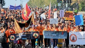 People take part in a march on National Day for Truth and Reconciliation in Montreal, Saturday, September 30, 2023. THE CANADIAN PRESS/Graham Hughes