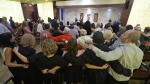 Worshipers sing as they pray for peace, during a Shabbat service, Friday, Sept. 27, 2024, at Temple Beth Sholom in Miami Beach, Fla. (AP Photo/Wilfredo Lee)