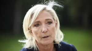 French far-right leader Marine Le Pen answers reporters at the Elysee Palace after a meeting with French President Emmanuel Macron, Aug. 26, 2024 in Paris. (AP Photo/Thomas Padilla, File)