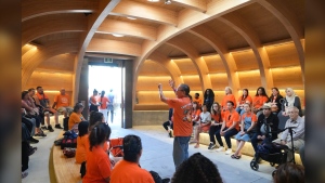 John Keeshig, who's spirit name is Maya-Waasige, talks to visitors in the Teaching Lodge situated in Nathan Phillips Square, in Toronto, Monday, Sept. 30, 2024. The Lodge is designed to reinforce the importance of family, represents life's journey and is a spiritual home for all First Nation People. THE CANADIAN PRESS/Chris Young