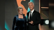 FILE - Mary Beth Evans, left, and Drake Hogestyn present the award for outstanding daytime talk series host during the 50th Daytime Emmy Awards on Friday, Dec. 15, 2023, in Los Angeles. Hogestyn, who played John Black for nearly four decades, has died from pancreatic cancer at age 70. (AP Photo/Chris Pizzello, File)