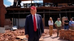 Republican presidential nominee former President Donald Trump speaks outside the Chez What furniture store as he visits Valdosta, Ga., a town impacted by Hurricane Helene, Monday, Sept. 30, 2024. (AP Photo/Evan Vucci) 