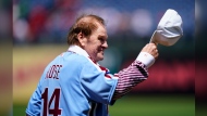 FILE - Former Philadelphia Phillies player Pete Rose tips his hat to fans during an alumni day, Aug. 7, 2022, in Philadelphia. (AP Photo/Matt Rourke, File)