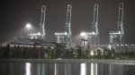 Hundreds of longshoremen strike together outside of the Virginia International Gateway in Portsmouth, Va., Tuesday, Oct. 1, 2024. (Billy Schuerman/The Virginian-Pilot via AP)