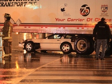 A man was charged with impaired driving after crashing his car underneath a big rig. (CP24/Tom Stefanac)