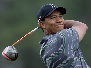 Tiger Woods watches his tee shot on the first hole during the first round of the Masters golf tournament in Augusta, Ga., Thursday, April 8, 2010. (AP Photo/Morry Gash)