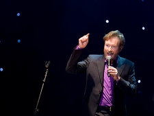 Comedian Conan O'Brien performs during a stop of "The Legally Prohibited From Being Funny on Television Tour" in Vancouver, B.C. Tuesday, April 13, 2010. (THE CANADIAN PRESS/Jonathan Hayward)