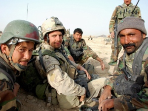 Master Cpl. Shawn Grove, of Barrhead Alberta, centre, talks with unidentified Afghan soldiers during a recent operation on March 29, 2010, in Khekjakak, Afghanistan. 